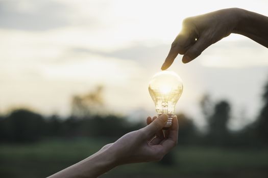 Innovation or creative concept of hand hold a light bulb and copy space for insert text.