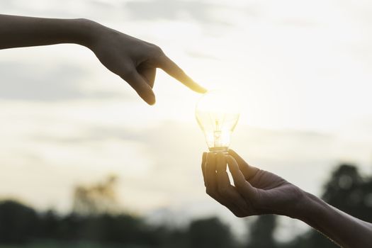 Innovation or creative concept of hand hold a light bulb and copy space for insert text.