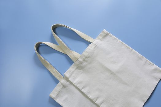 White tote bag canvas fabric. Cloth shopping sack mockup with copy space.