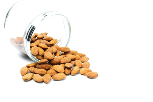 Fresh almond with glass jar isolated on white background. Food and healthy concept