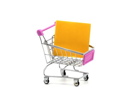 Sticky note and shopping cart isolated and white background.