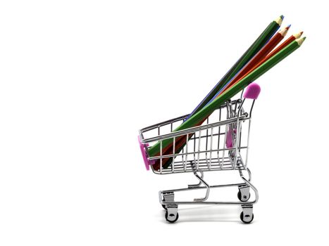 Color pencils and shopping cart isolated and white background.