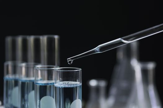 Glass laboratory chemical test tubes with liquid for analytical , medical, pharmaceutical and scientific research concept.