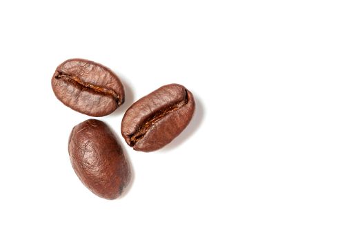 A spread coffee beans isolated on white background and copy space