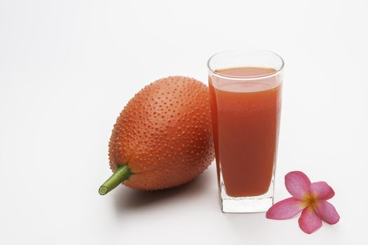 Baby Jackfruit, Gac fruit with baby jackfruit juice isolated on white background. Drink and healthy concept.