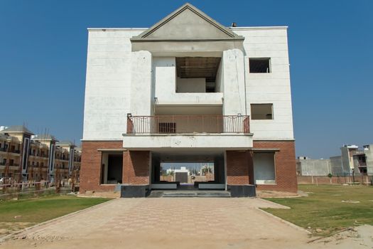front view of New built of building, sonipat, haryana, july 2019 Photo : Technical Maanav / Yaymicro.com
