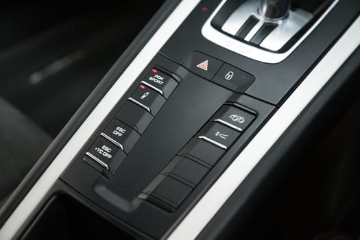 Central tube with control buttons in car interior