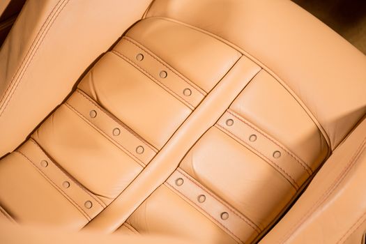 Close up of leather car seat in brown