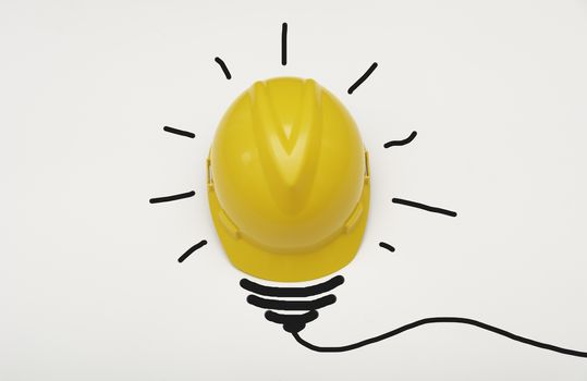 Concept idea with safety helmet light bulb isolate on white background