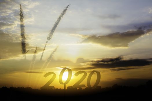 2020 Happy new year numbers on sunset sky background