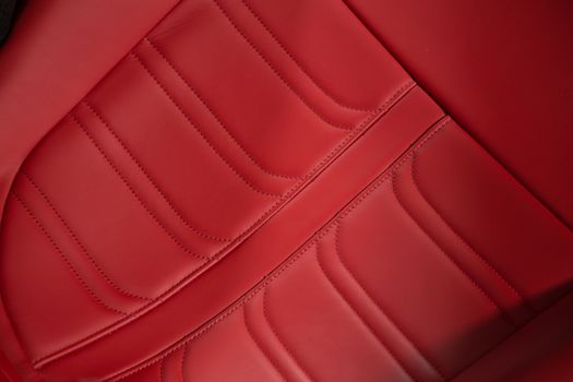 Close up of leather car seat in red