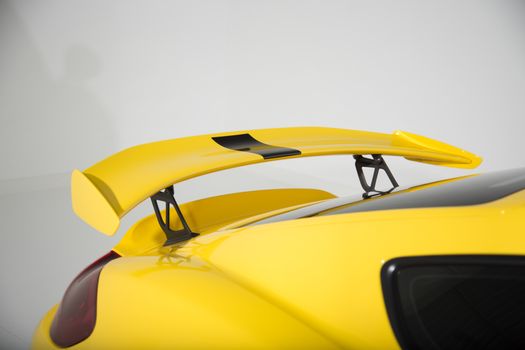 Rear spoiler on yellow sports car