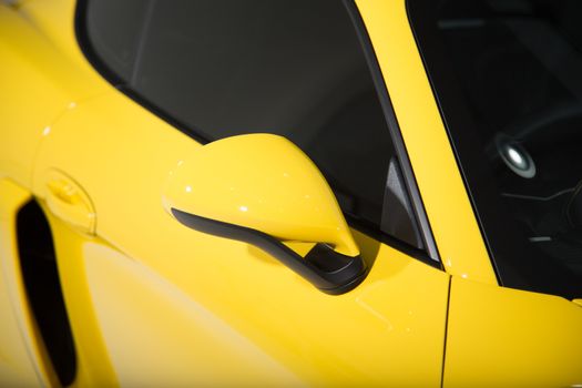 Yellow sports car mirror