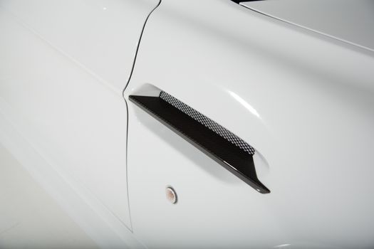 Close up of carbon fibre part on car exterior