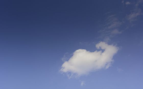 Blue sky with cloud and copy space. Clear weather background. 