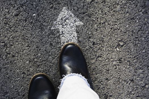 Shoes standing at the crossroad and get to decision which way to go. Ways to choose concept.