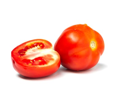 Fresh tomatoes and tomato slice isolated on white background. Close up of tomatoes.