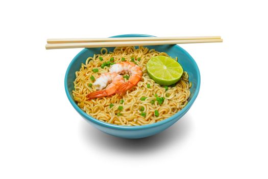 Bowl of instant noodles and shrimps with chopsticks isolated on white background. Food concept.