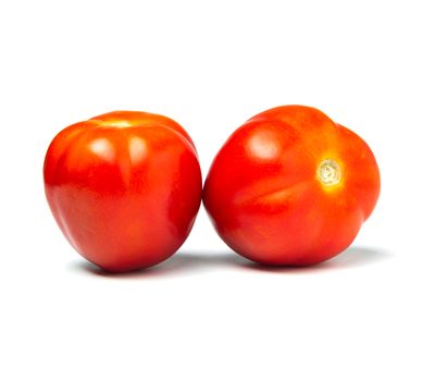 Fresh tomatoes isolated on white background. Close up of tomatoes.