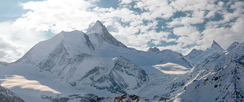 The Weisshorn and surrounding mountains in the swiss alps.