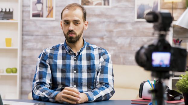 Famous young man recording a vlog for subscribers. Influencer using modern technology for vlogging.