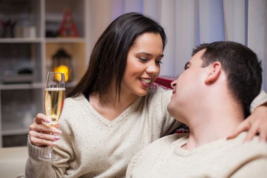 Caucasian man on christmas day with his beautiful wife wearing matching clothes.