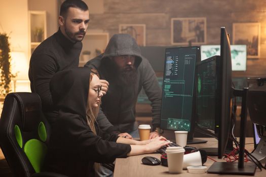 Team of hackers hired by government to test their firewall with dangerous malware. Female hacker.