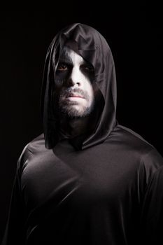 Creepy man dressed up like grim reaper for halloween.