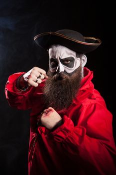 Medieval mariner with beard and hat isolated over black background. Halloween costume.