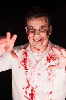 Creative make up of man dressed up like zombie for halloween.