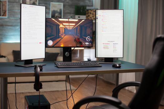 Close up of empty room with powerful computer ready for online gaming and streaming.