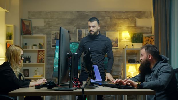 Dangerous hacker with his team doing cyber crimes from his apartment.