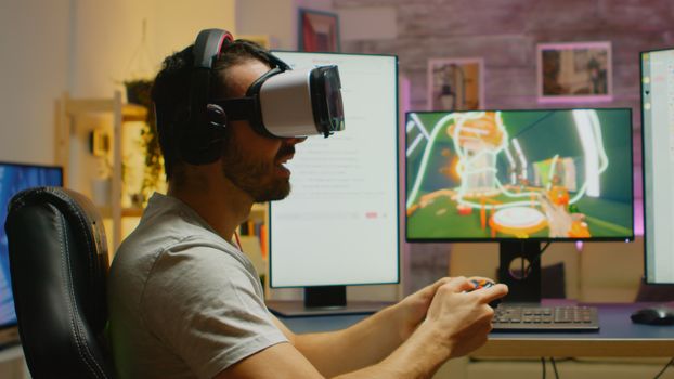 Young man playing shooter games wearing virtual reality headset. Wireless controller.