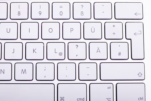 White aluminum keyboard in close up. Technology and communication