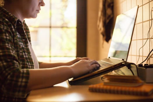 Businesswoman working on laptop from home during covid-19.