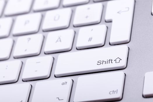 Aluminium keyboard close up shooting. Studio photo. Standard keyboard in close up shooting with blurred background