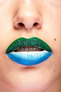 Beauty image of lips with artistic make up in studio photo