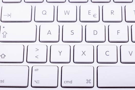 White aluminum keyboard in close up. Technology and communication