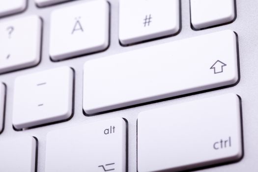 White aluminum keyboard in close up. Technology and communication