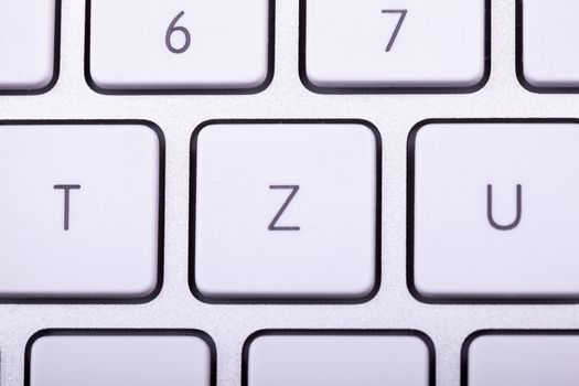 White aluminum keyboard in close up. Technology and communication