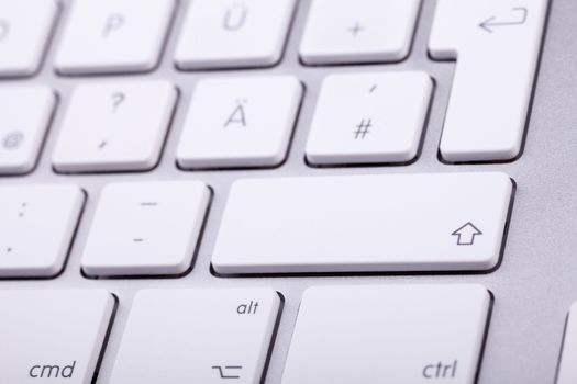 White aluminum keyboard in close up. Technology and communication