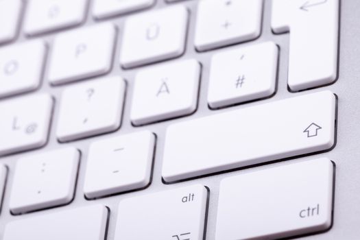 White aluminum keyboard in close up. Technology and communication