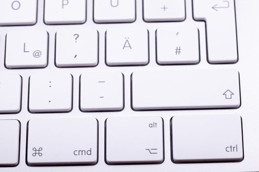 White aluminum keyboard in close up. Technology and communication