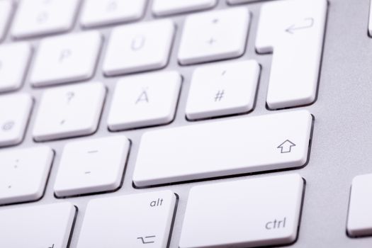 White aluminum keyboard in close up. Technology and communication