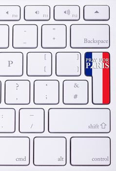 Pray for Paris sign on france flag in keyboard. International suport for Paris victims in terrorist atack
