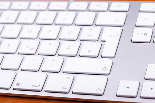 White aluminum keyboard in close up. Technology and communication