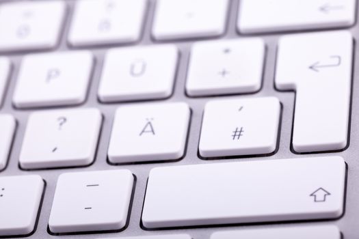 White aluminum keyboard in close up. Technology and communication