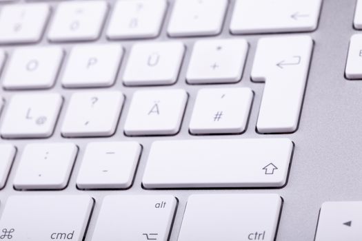 White aluminum keyboard in close up. Technology and communication