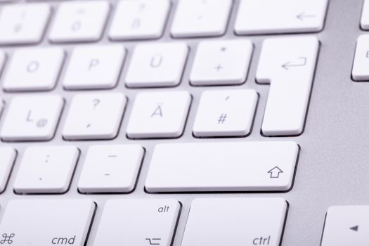 White aluminum keyboard in close up. Technology and communication