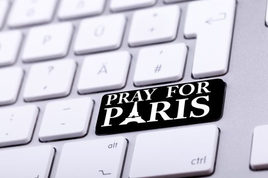 Keyboard with pray for paris text and symbol. International support for france against terrorist atack from Paris